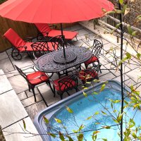Aperçu: Customer photo of the June 6 seater garden table and chairs in antique bronze with terracotta cushions and parasol