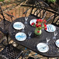 Aperçu: Close up the June 6 seater garden table and April chairs in antique bronze